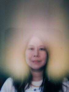 Claire's aura photo with a gold and pink aura. Reiki training has changed my aura and life.