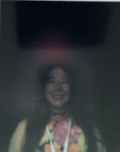Claire's aura photo with red showing headache. Tired shown by darkness and lack of color